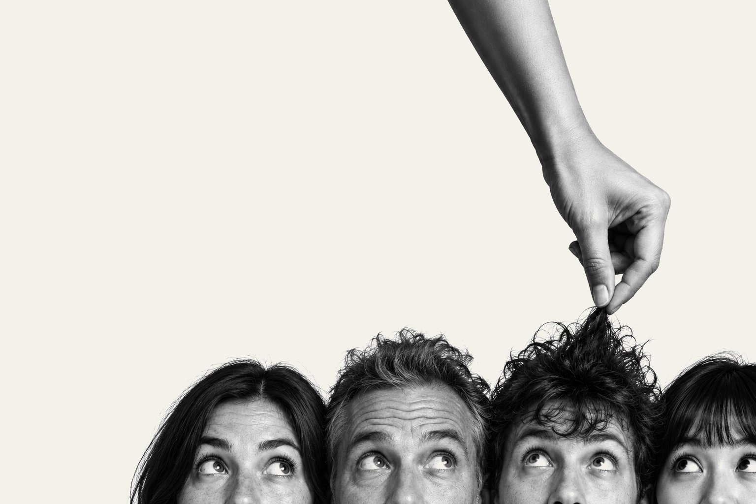 A row of heads cut off at level on paper, with one being picked out by hand