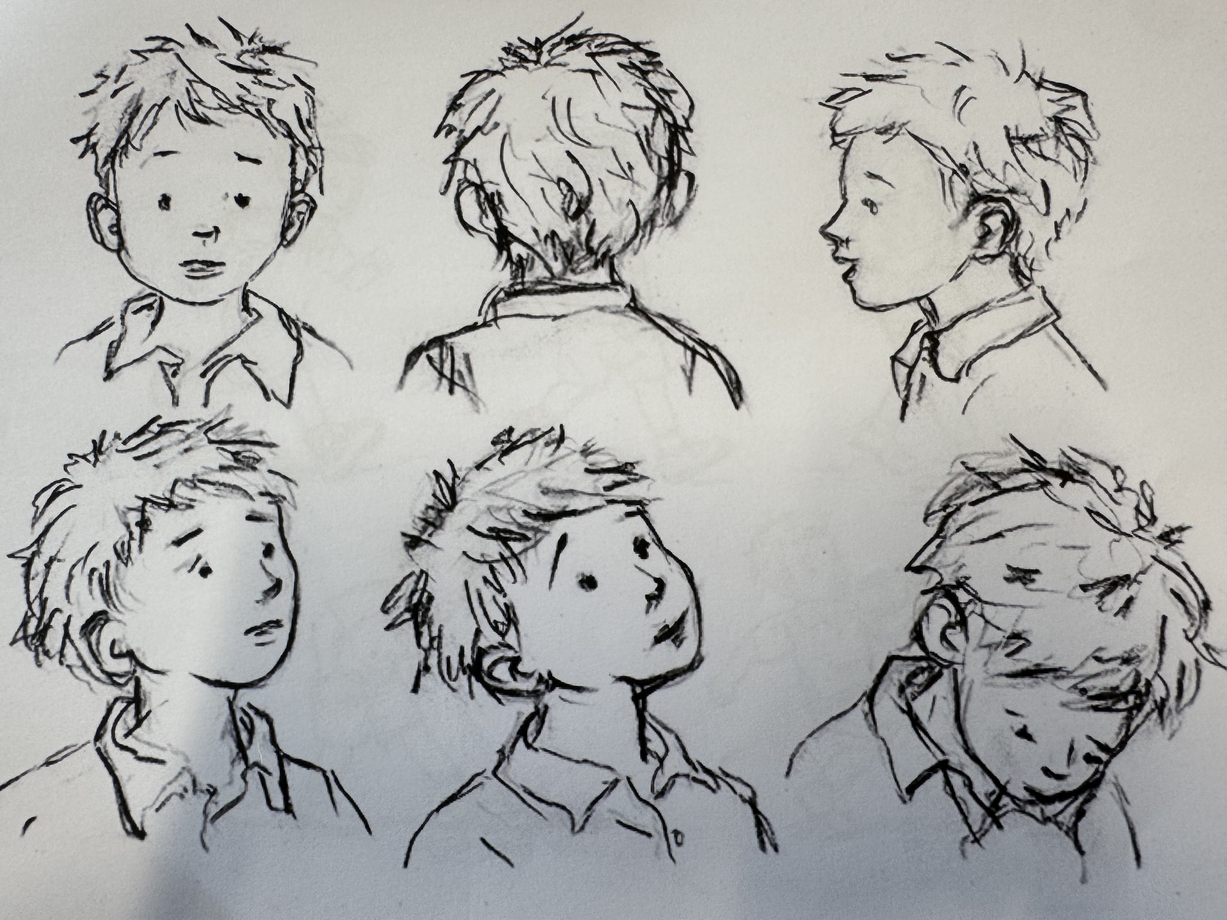 Character expression sheet showing six angles of a boy's head, drawn by Illana Greener